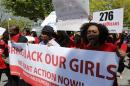 Protesters march in support of the girls kidnapped by members of Boko Haram in front of the Nigerian Embassy in Washington