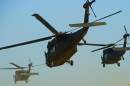 Iraqi military helicopters fly out of Baghdad International Airport