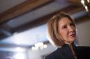 Former Hewlett-Packard Chief Executive Fiorina listens to a question from the media after speaking at the New England Council's "Politics and Eggs" breakfast in Bedford