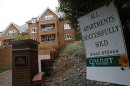 A sign is seen outside some newly built apartments in Berkhampstead, southern England