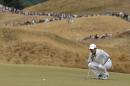 Rory McIlroy, of Northern Ireland, lines up his putt on the 13th hole during the first round of the U.S. Open golf tournament at Chambers Bay on Thursday, June 18, 2015 in University Place, Wash. (AP Photo/Charlie Riedel)