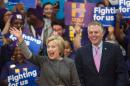 Democratic presidential hopeful Hillary Clinton (L) waves to the crowd beside Virginia Governor Terry McAuliffe during a campaign rally on February 29, 2016 at George Mason University in Fairfax, Virginia