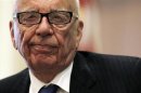 News Corp Chairman and CEO Murdoch reacts to a point as he takes part in a discussion at the "The Economics and Politics of Immigration" Forum in Boston