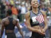 Allyson Felix, right, celebrates her win in the women's 200 meters at the U.S. Olympic Track and Field Trials Saturday, June 30, 2012, in Eugene, Ore. Felix won the 200 but she and Jeneba Tarmoh, walking off at left rear, tied for third place in the 100 meters. (AP Photo/Marcio Jose Sanchez)