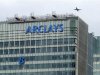 The letter "B" of the signage on the Barclays headquarters in Canary Wharf is hoisted up the side of the building in London