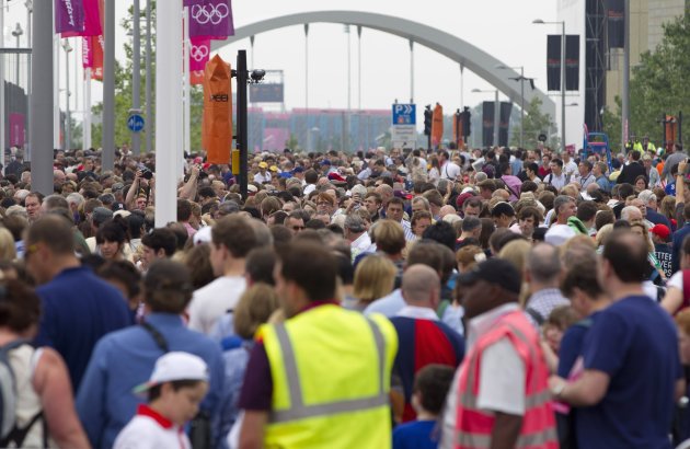 People queue to get into the Olympic Park for the opening ceremony of the 2012 Olympic Games in London