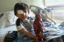 This Feb. 2014 photo provided by Flor Medrano shows Kevin Vicente in Phoenix, Ariz. Four-year-old Kevin Vicente's road to recovery after a dog mauling on Feb. 20, 2014, which left him with a broken eye socket and jaw, and the boy has months, if not years, of reconstructive surgery ahead of him. The attack has ignited thousands of impassioned pleas, not just not for him. The animal behind the attack is now the object of a Facebook page, 