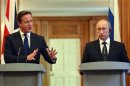 Britain's Prime Minister David Cameron and Russia's President Vladimir Putin hold a joint news conference in 10 Downing Street, central London