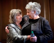 Susan Harrison, 63, of Lawrenceville, Ga., left, and Vea Gaby, 73, of Athens, embrace after telling their stories about complications from having surgical mesh placed in their pelvic cavities following an interview in their attorney's office, Monday, Jan. 28, 2013, in Athens, Ga. The Georgia women are some of the thousands of women nationwide who have sued manufacturers of the surgical mesh, claiming they’ve suffered severe complications and intense physical pain when the flexible plastic mesh hardened inside their bodies. (AP Photo/David Goldman)