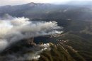 Smoke rises around Rampart Reservoir from Waldo canyon wildfire in this aerial photograph taken in Colorado Springs Colorado