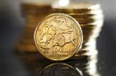 Photo illustration shows Australian one dollar coins in Sydney