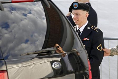 Army Private First Class Bradley Manning is escorted in handcuffs as he leaves the courthouse in Fort Meade, Maryland June 6, 2012. REUTERS/Jose Luis Magana