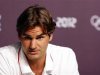 Swiss tennis player Federer answers a reporter's question during a news conference in the Olympic media centre before the start of the London 2012 Olympic Games