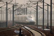A high-speed train departs a platform in Hebei province, south of Beijing, on December 22, 2012. China has started service on the world's longest high-speed rail route, Beijing to Guangzhou, the latest milestone in the country's rapid and -- sometimes troubled -- super fast rail network