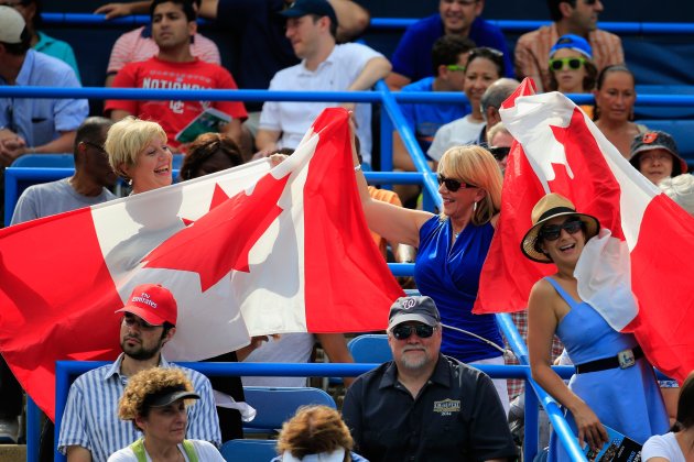 Fans hold up the Canadian flag during the mens finals match at the Citi Open. (Rob Carr/Getty Images)