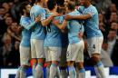 Manchester City players celebrate after Sergio Aguero scored against West Bromich Albion during their English Premier League soccer match at the Etihad Stadium, Manchester, England, Monday April 21, 2014. (AP Photo/Rui Vieira)