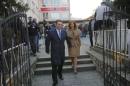 Leader of Macedonian ruling party VMRO-DPMNE and former Prime Minister Gruevski leaves a polling station with his wife Borkica after casting his vote during elections in Skopje