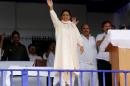 BSP chief Mayawati waves to her supporters during an election campaign rally in Lucknow