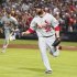 Cardinals pitcher Motte and his teammate Craig run off the field as they celebrate their win over the Atlanta Braves for the wild card at their MLB National League Wild Card playoff baseball game in Atlanta