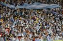 Argentina's fans celebrate after the group F World Cup soccer match between Argentina and Iran at the Mineirao Stadium in Belo Horizonte, Brazil, Saturday, June 21, 2014. Lionel Messi scored a superb goal in stoppage time to give Argentina a 1-0 victory over Iran.(AP Photo/Sergei Grits)