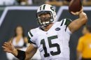 Jets quarterback Tim Tebow passes against Panthers in pre-season NFL football game in East Rutherford