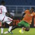 Sinkala of Zambia fights for the ball with Kamal of Sudan during their African Nations Cup quarter-final soccer match in Bata