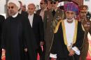 Sultan Qaboos, second right, receives Iranian president Hassan Rouhani, left, at Al Alalam Palace in Muscat, Oman, Wednesday, March 12, 2014. Rouhani is in Oman for a two day visit. (AP Photo/Abo Zayed)