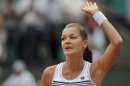 Radwanska of Poland reacts after winning her match against Williams of the U.S. during the French Open tennis tournament at the Roland Garros stadium in Paris