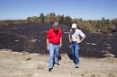 Nebraska Gov. Heineman, left, talks with Scott Josiah, state forester and director of Nebraska Forest Service, as they inspect fire damage at Chadron State Park, Sunday, Sept. 2, 2012, near Chadron, Neb. Officials estimated Sunday that the fires have now burned roughly 273 square miles, including at least 27,000 acres in South Dakota. That's up from roughly 93 square miles on Saturday and more than twice the size of Omaha. (AP Photo/Omaha World-Herald, Jeff Beiermann, Pool)