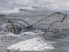 FILE - In this Wednesday, Oct. 31, 2012 file photo, waves wash over a roller coaster from a Seaside Heights, N.J., amusement park that fell in the Atlantic Ocean during Superstorm Sandy. (AP Photo/Mike Groll, File)