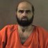 FILE - This undated photo provided by the Bell County Sheriff's Department via The Temple Daily Telegram shows Nidal Hasan. A military judge said Wednesday, July 25, 2012, the Army psychiatrist charged in the fatal Fort Hood shooting rampage will be forcibly shaved if he doesn't remove his beard on his own. The beard violates Army regulations.  (AP Photo/Bell County Sheriff's Department via The Temple Daily Telegram)