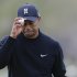 Tiger Woods tips his hat to fans after putting on the 11th green in the first round against Charles Howell III during the Match Play Championship golf tournament, Thursday, Feb. 21, 2013, in Marana, Ariz. (AP Photo/Ted S. Warren)