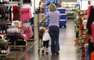 A woman shops with her daughter at a Walmart Supercenter in Rogers, Arkansas June 6, 2013. REUTERS/Rick Wilking