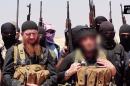 Omar al-Shishani (real name Tarkhan Batirashvili) (C-L) pictured at an unknown location between Iraq's Nineveh province and the Syrian town of Al-Hasakah in an image made available by Jihadist media outlet al-Itisam Media on June 29, 2014