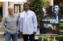 Director Tony Scott and U.S. actor Denzel Washington pose during a photocall to promote the film "The Taking of Pelham 123" in Paris