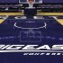FILE - In this Dec. 15, 2012, file photo, a Big East Conference logo is displayed on the court after Georgetown played Western Carolina in an NCAA college basketball game at the Verizon Center in Washington.  Big East football schools will get almost all of a $110 million pot in a deal that will allow seven departing basketball schools to keep the name Big East and start playing in their own conference next season, a person familiar with the negotiations says. The basketball schools, which include Georgetown, St. John's, Villanova, Seton Hall, Providence, Marquette and DePaul, will receive $10 million, keep the conference name and the right to play their conference tournament at Madison Square Garden. (AP Photo/Jacquelyn Martin, File)