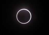 An annular solar eclipse is seen in the sky over Yokohama near Tokyo Monday, May 21, 2012. The annular solar eclipse, in which the moon passes in front of the sun leaving only a golden ring around its edges, was visible to wide areas across the continent Monday morning. (AP Photo/Koji Sasahara)