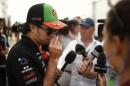 Force India Formula One driver Sergio Perez of Mexico talks to members of the media ahead of the British Grand Prix at the Silverstone Race Circuit, central England