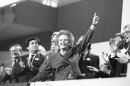File photo of British Prime Minister Margaret Thatcher pointing skyward as she receives standing ovation at Conservative Party Conference