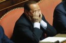 Italy's former Prime Minister Berlusconi gestures during a vote session at the Senate in Rome