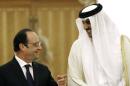 French President Francois Hollande, left, talks with Qatar's Emir Sheikh Tamim bin Hamad Al-Thani, left, at the Diwan Palace in Doha, Qatar, Monday, May 4, 2015. French President Francois Hollande will sign a 7-billion-euro fighter jet deal and then gets a starring role in a regional summit in Saudi Arabia. Qatar becomes the third buyer of France's delta-winged Rafale, manufactured by Dassault Aviation. (AP Photo/Christophe Ena, Pool)
