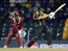 Australia's Watson is bowled as West Indies' Ramdin looks on during the ICC world Twenty20 semi-final at the R Premadasa Stadium, Colombo