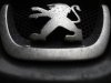Raindrops are seen on a Peugeot car parked in Paris