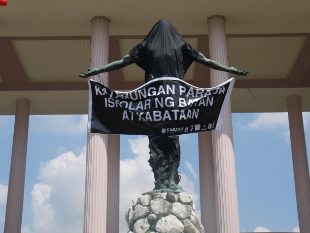 The famed oblation statue outside the premier state university's Quezon Hall was draped with a black cloth, following the suicide of a UP Manila student.