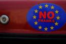 A car sticker with a logo encouraging people to leave the EU is seen on a car, in Llandudno, Wales.