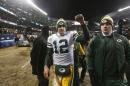 Green Bay Packers quarterback Aaron Rodgers (12) celebrates after an NFL football game against the Chicago Bears, Sunday, Dec. 29, 2013, in Chicago. The Packers won 33-28 to capture the NFC North title. (AP Photo/Charles Rex Arbogast)