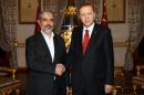 Palestinian Hamas leader Khaled Mashal (L) and Turkish President Recep Tayyip Erdogan (R), pictured on December 19, 2015, have met again for unscheduled talks in Istanbul