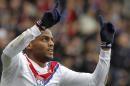 Lyon's Jimmy Briand celebrates after scoring a goal against Ajaccio during their French League One soccer match at Gerland stadium, in Lyon, central France, Sunday, Feb. 16, 2014. (AP Photo/Laurent Cipriani)