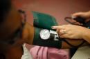 A nurse checks the blood pressure of a patient on July 10, 2012 in Los Angeles, California