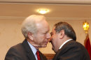 U.S. Sen. Joe Lieberman, left, greets Iraqi Foreign Minister Hoshyar Zebari, right, in Baghdad, Iraq, Tuesday, Sept 4, 2012. (AP Photo/Karim Kadim)